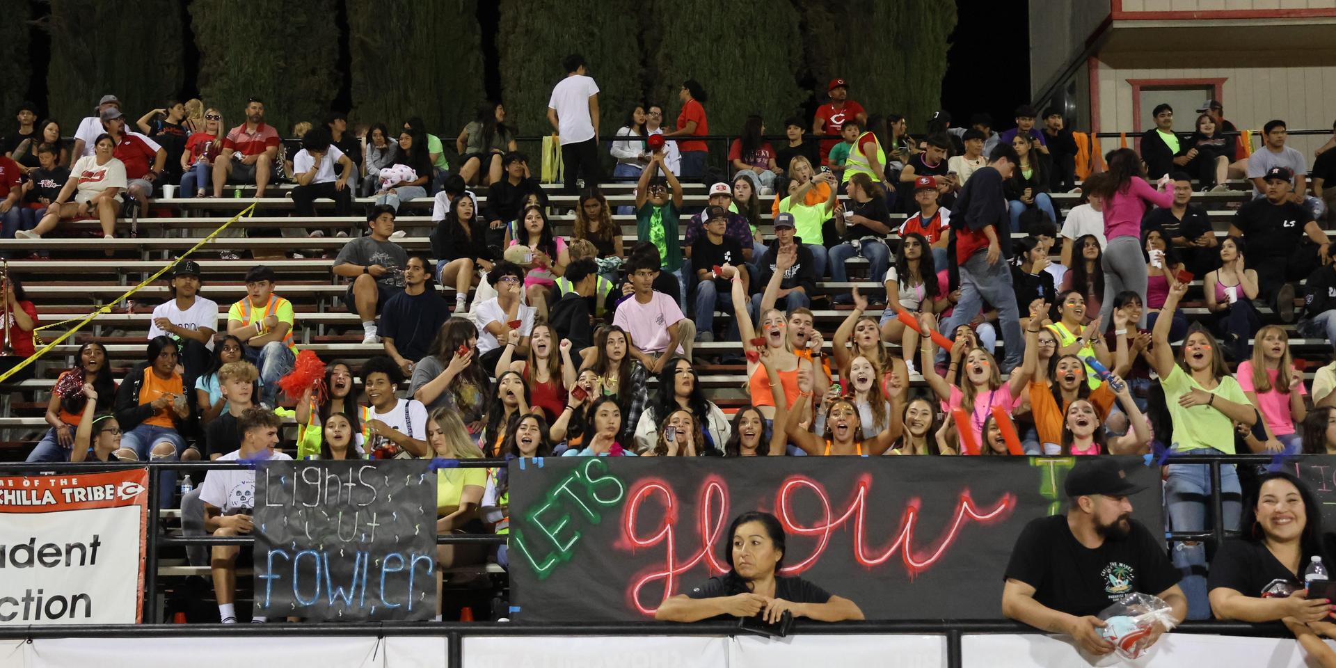 Students and community members enjoying the football game.