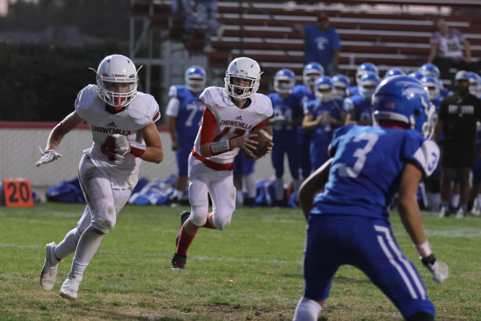 Junior Varsity football players in action against Caruthers