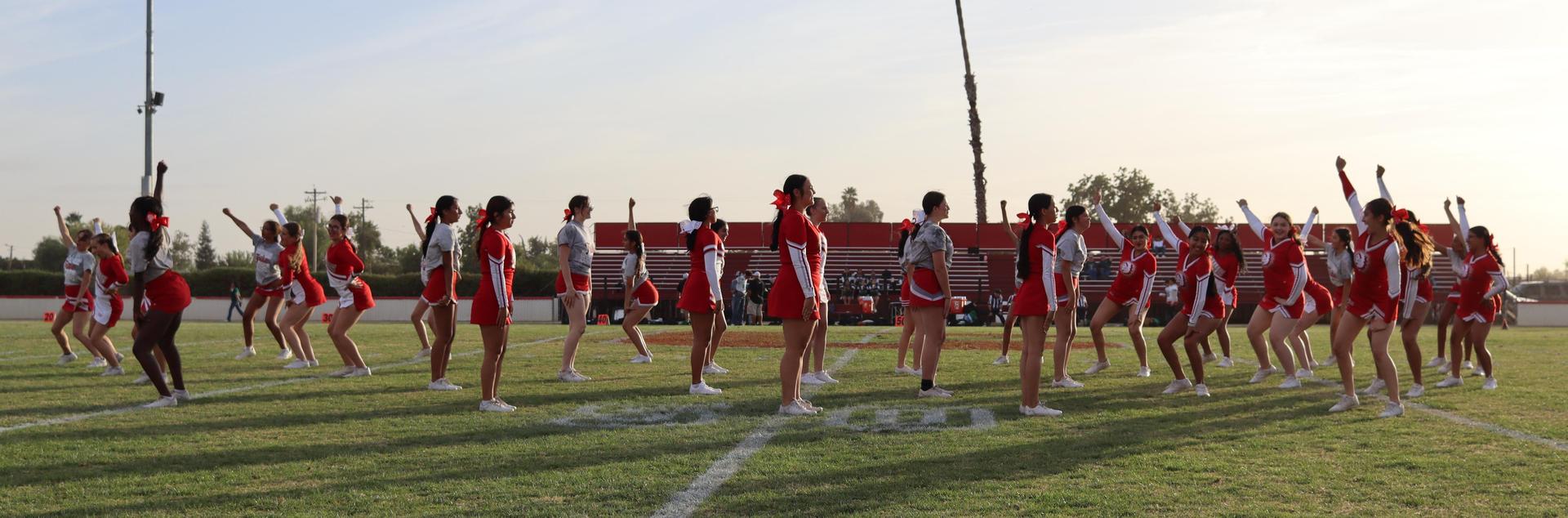 Cheerleaders performing at the football game