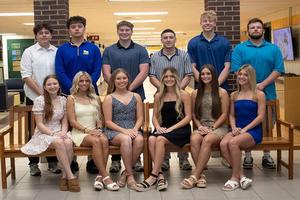 12 students, 6 boys and 6 girls, are gathered in the school lobby because they represent the prom court