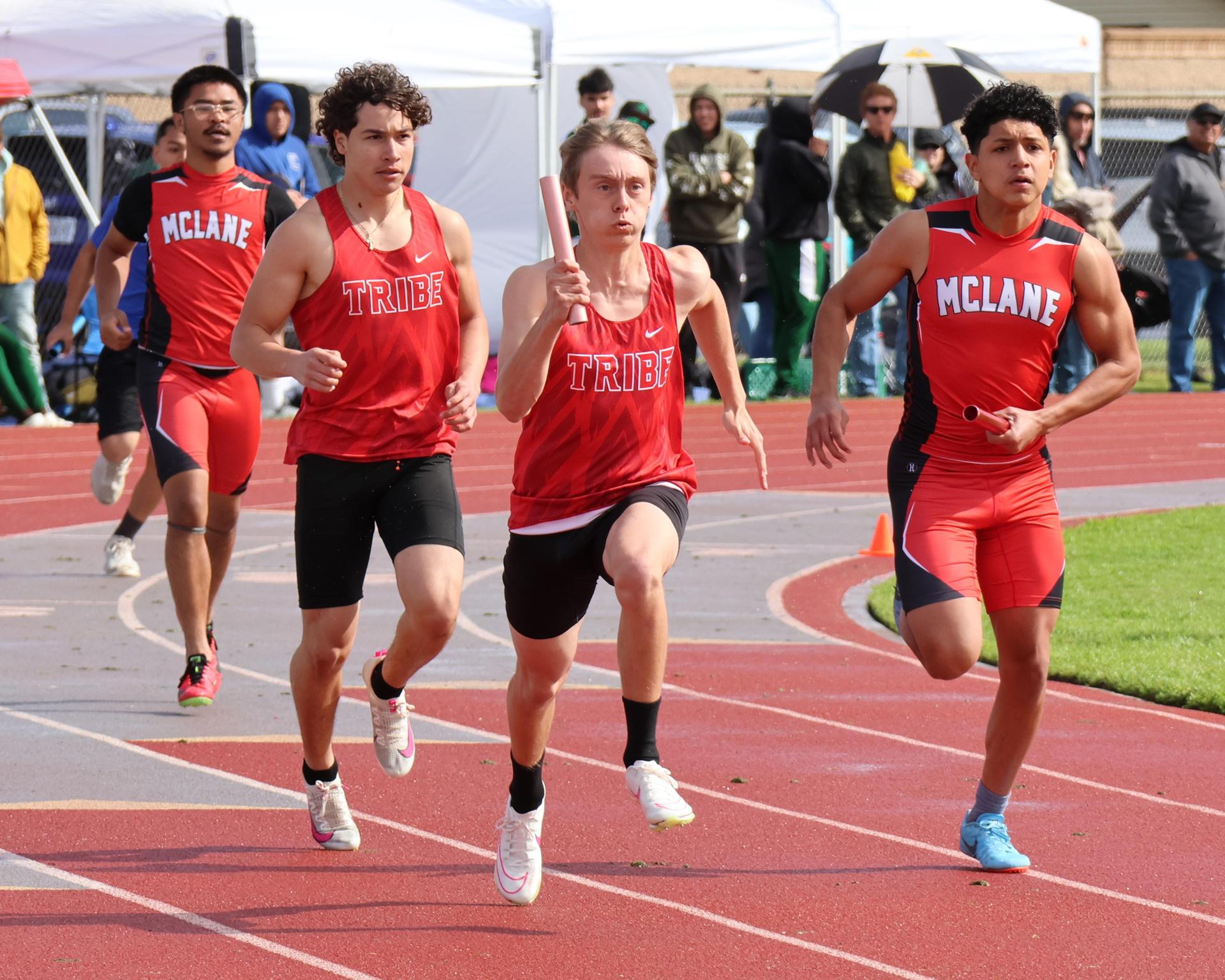 varsity boys running the four by 100 meter relay