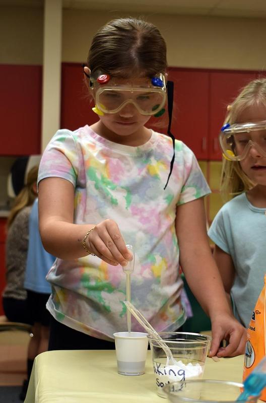 young students conducting science experiments