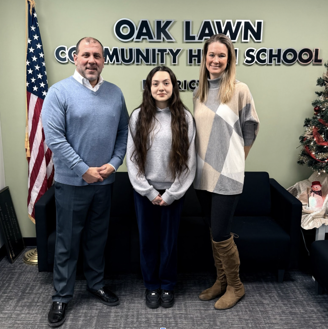 OLCHS staff member Ellen Kruger and senior Jazmin Fajardo, Superintendent Shahe Bagdasarian standing in the district office