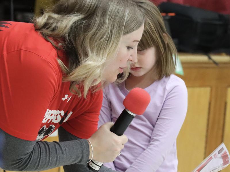 Teacher talking into a microphone