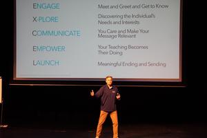 A presenter from Capturing Kids' Hearts talks to staff.