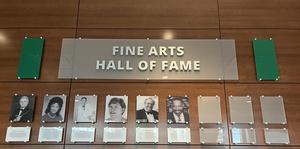 The first class of 6 inductees to the Fine Arts Hall of Fame is pictured on the wall