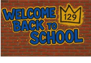 Welcome back to school and yellow crown with 129 in graffiti style on a brick wall