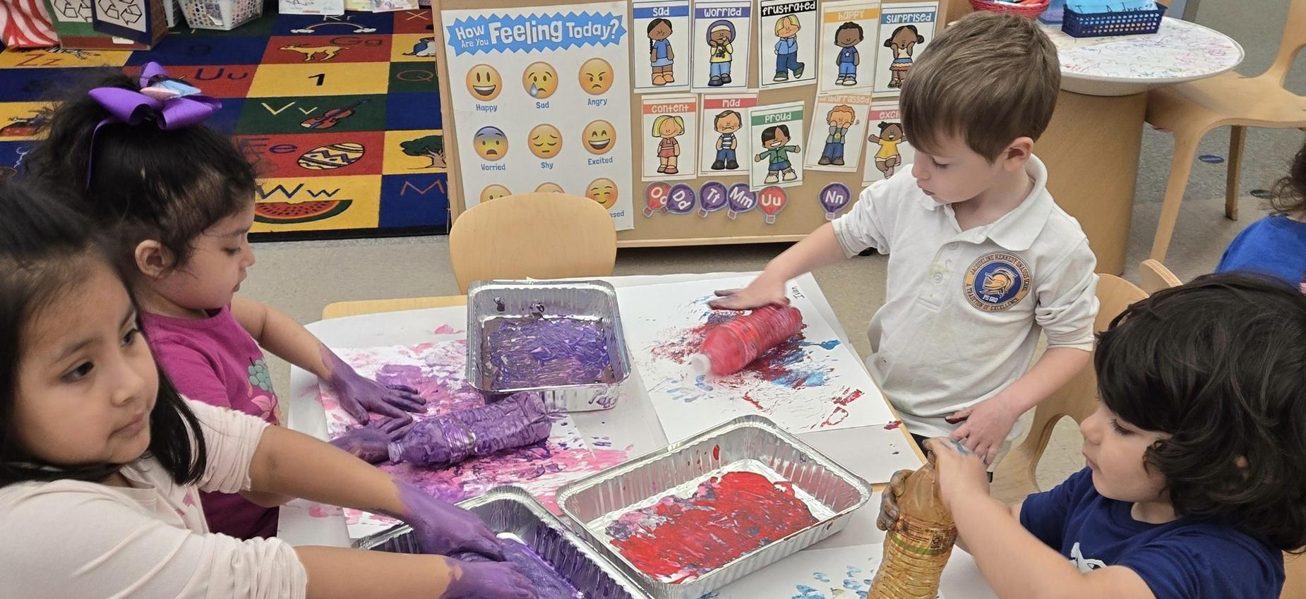 group of students using recycled materials to paint