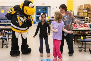 IceBurgh, Ms. Kline, and students dance