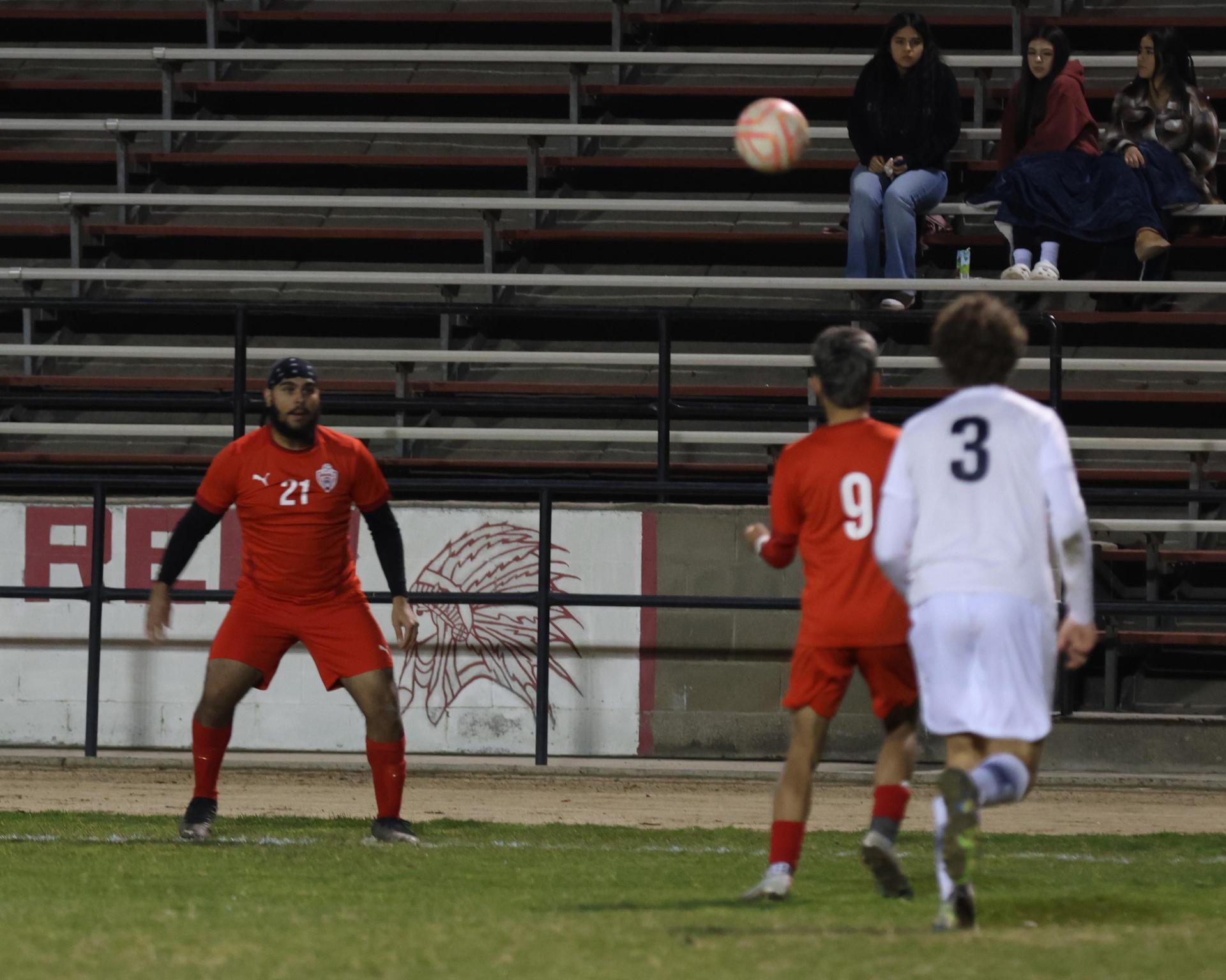 varisty boys soccer playing against yosemite