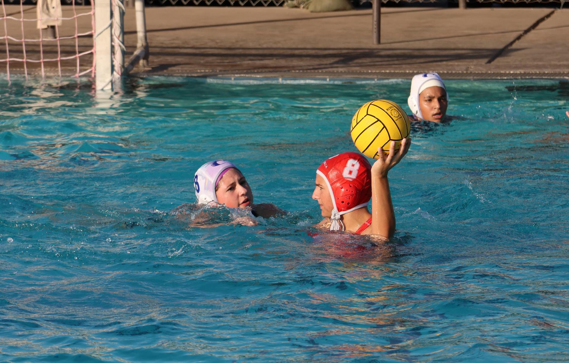 girls playing water polo against Sanger West