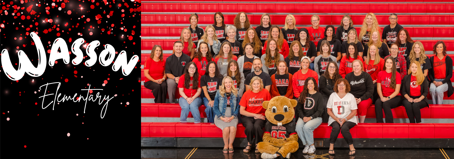 Group photo of Wasson Elementary staff with a mascot on a red bleacher background.