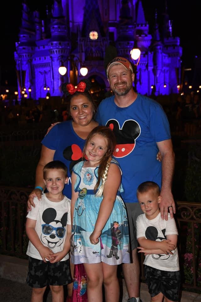 The Tunison Family in front of Magic Kingdom