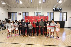 Image of Newtown Students and Staff cutting the ribbon for our new gymnasium.
