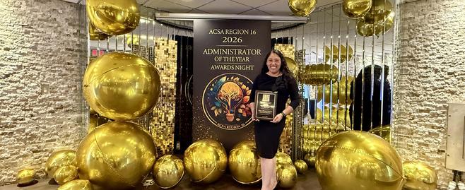 Principal Salazar with ACSA Award Plaque Photo