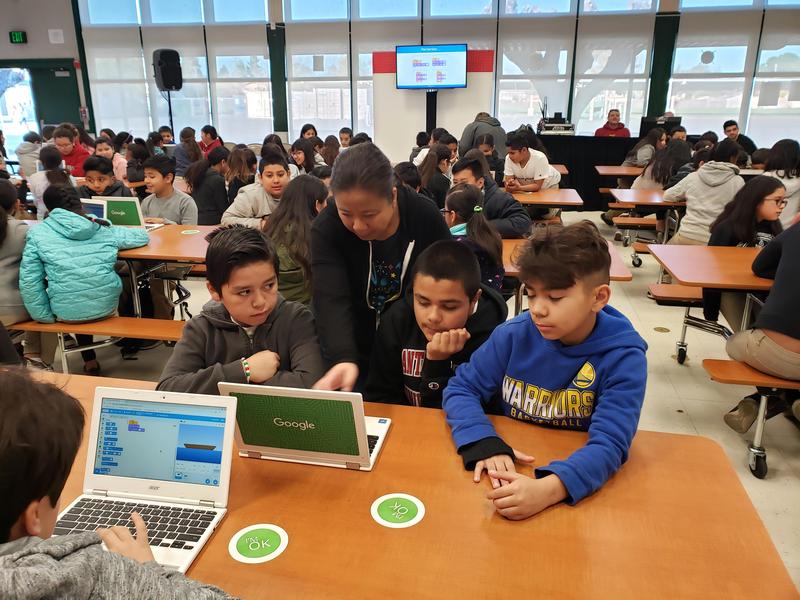 Students typing on computer