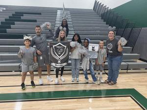 Image of new student ambassadors and staff.