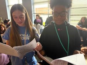 Students reading sheet music