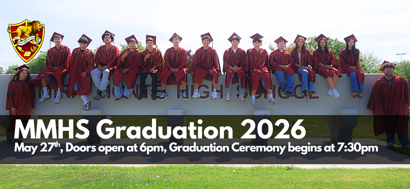 Students in graduation caps and gowns pose on a sign for MMHS Graduation 2026.