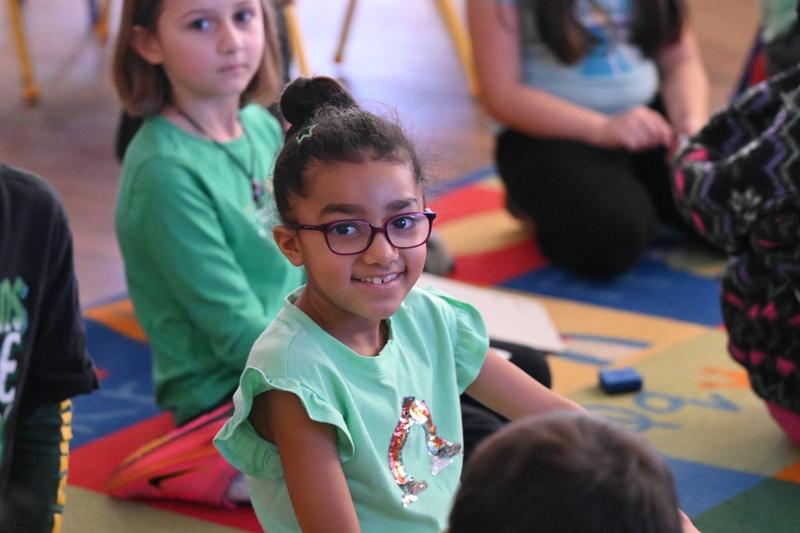 student smiling in class