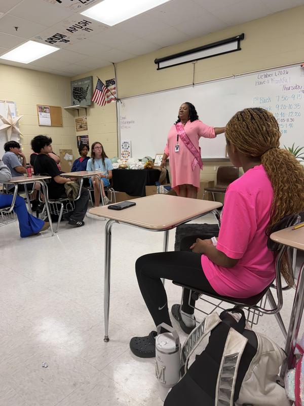 Ms. Elzie speaks to her students