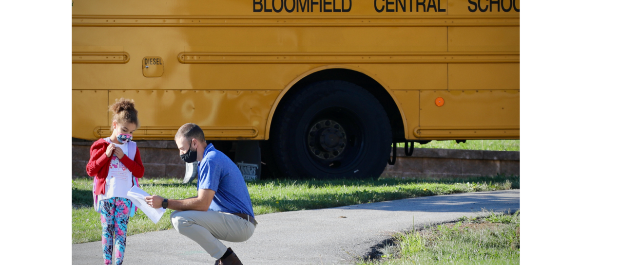 student and teacher looking at a schedule
