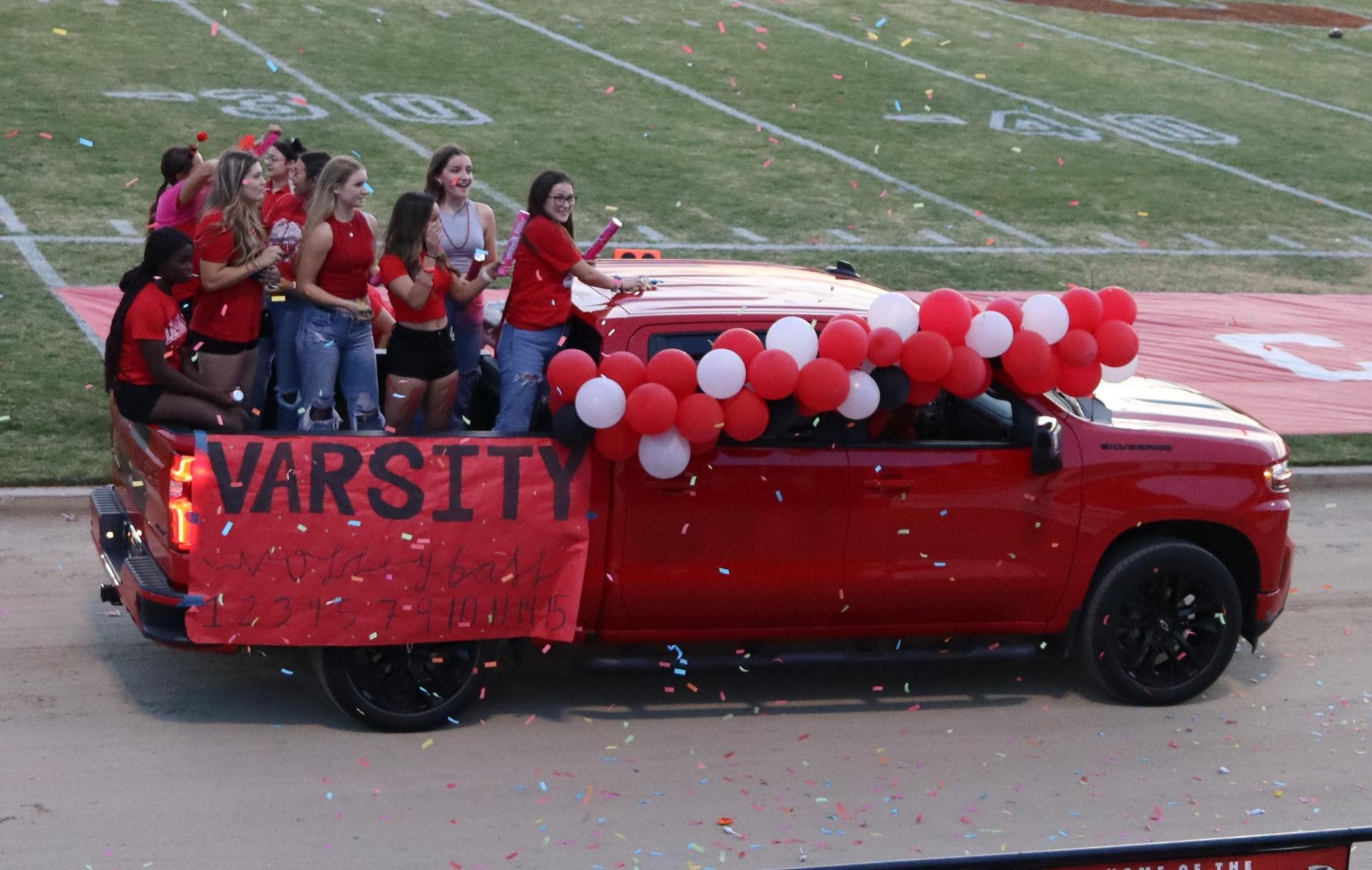 students, staff, and community members enjoying Friday night at the football game