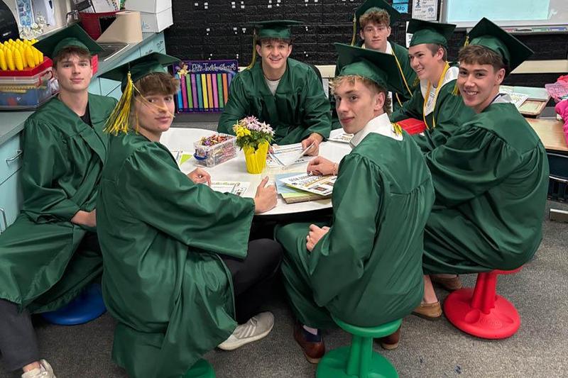Daniel Lerro, Matthew Lerro, Sean Goodman, Jake Lenart, Luke Fox, Cameron King, and Niko Cox take a seat during their walk through at Trafford Elementary