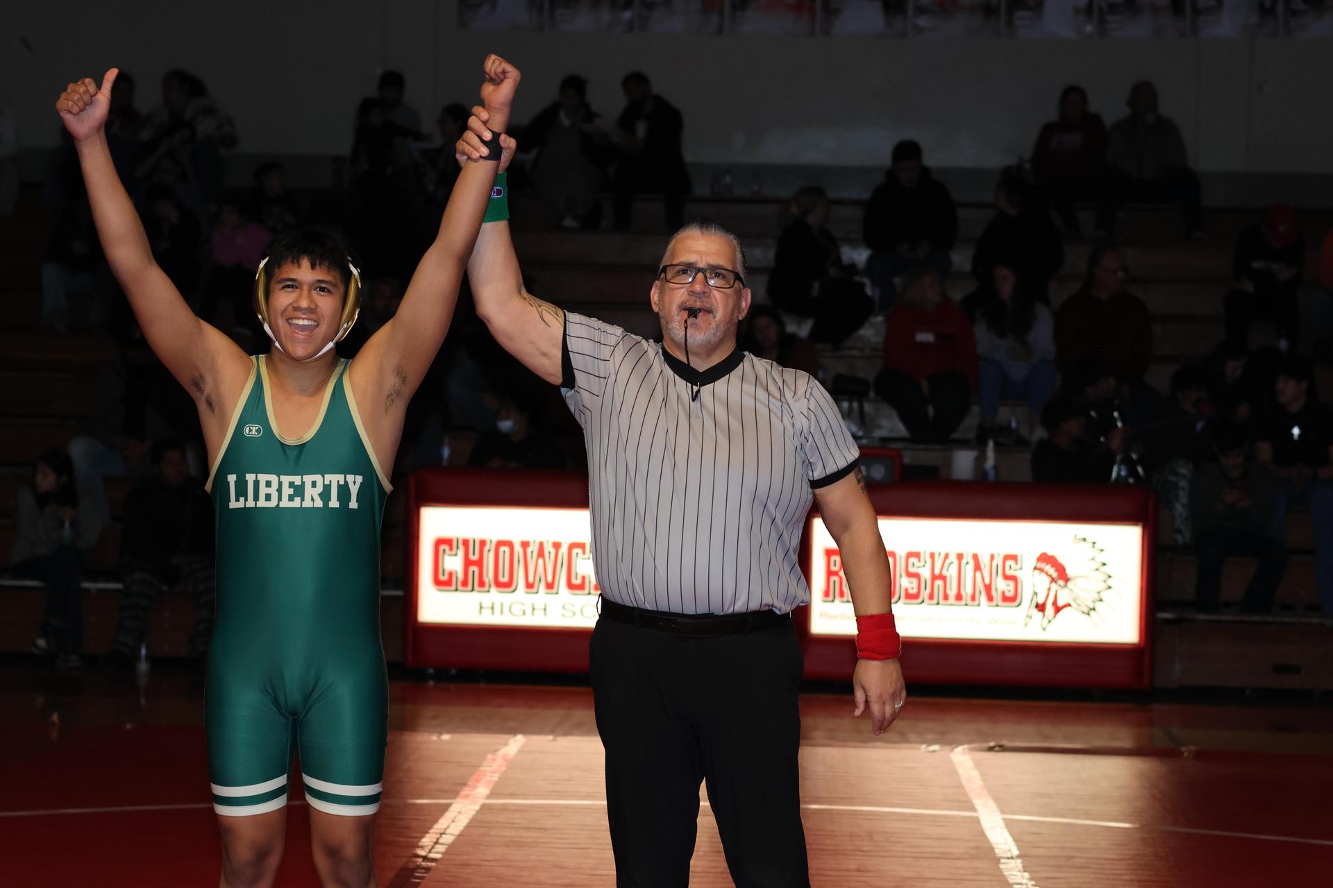 Wrestling winners with hands up 76