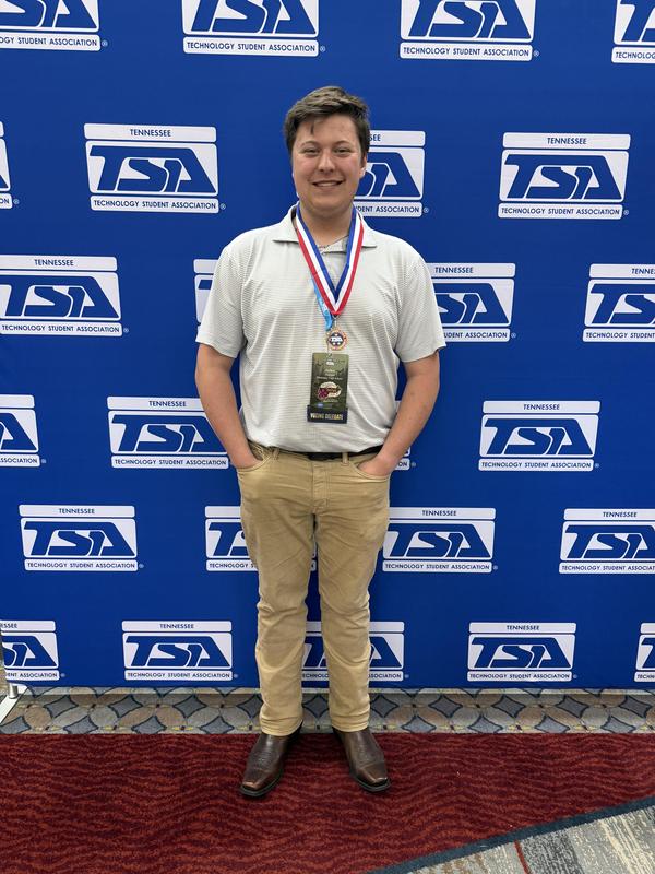 Male student with medallion around his neck