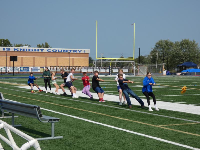 group of kids playing tug of war
