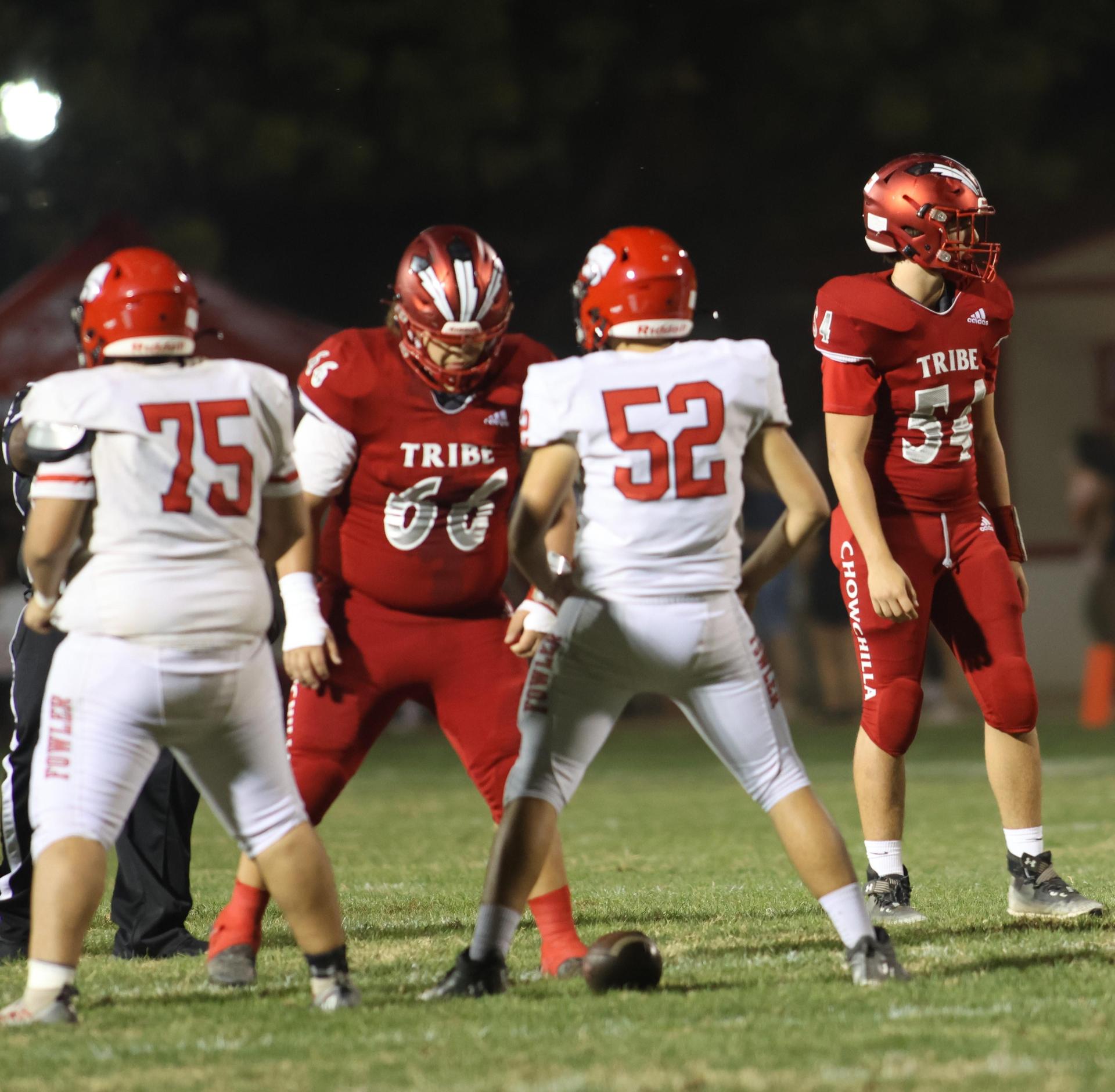 varsity boys playing football against Fowler