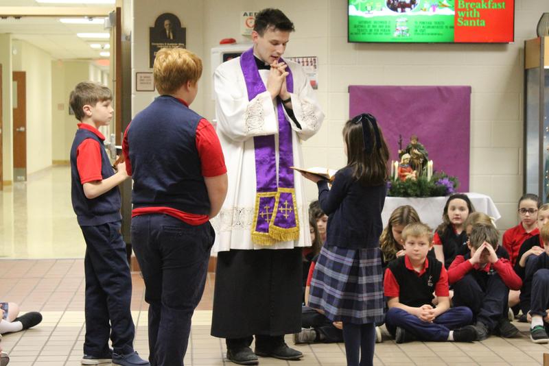 Father Michael with student helpers