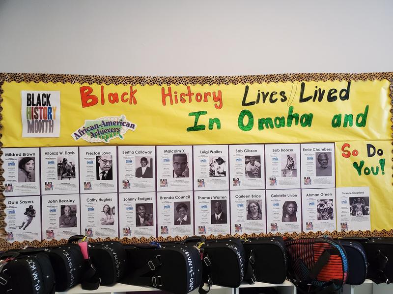 Image shows a bulletin board with famous black figures of Omaha