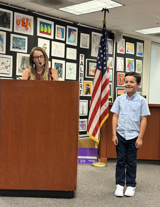 Student at podium for award