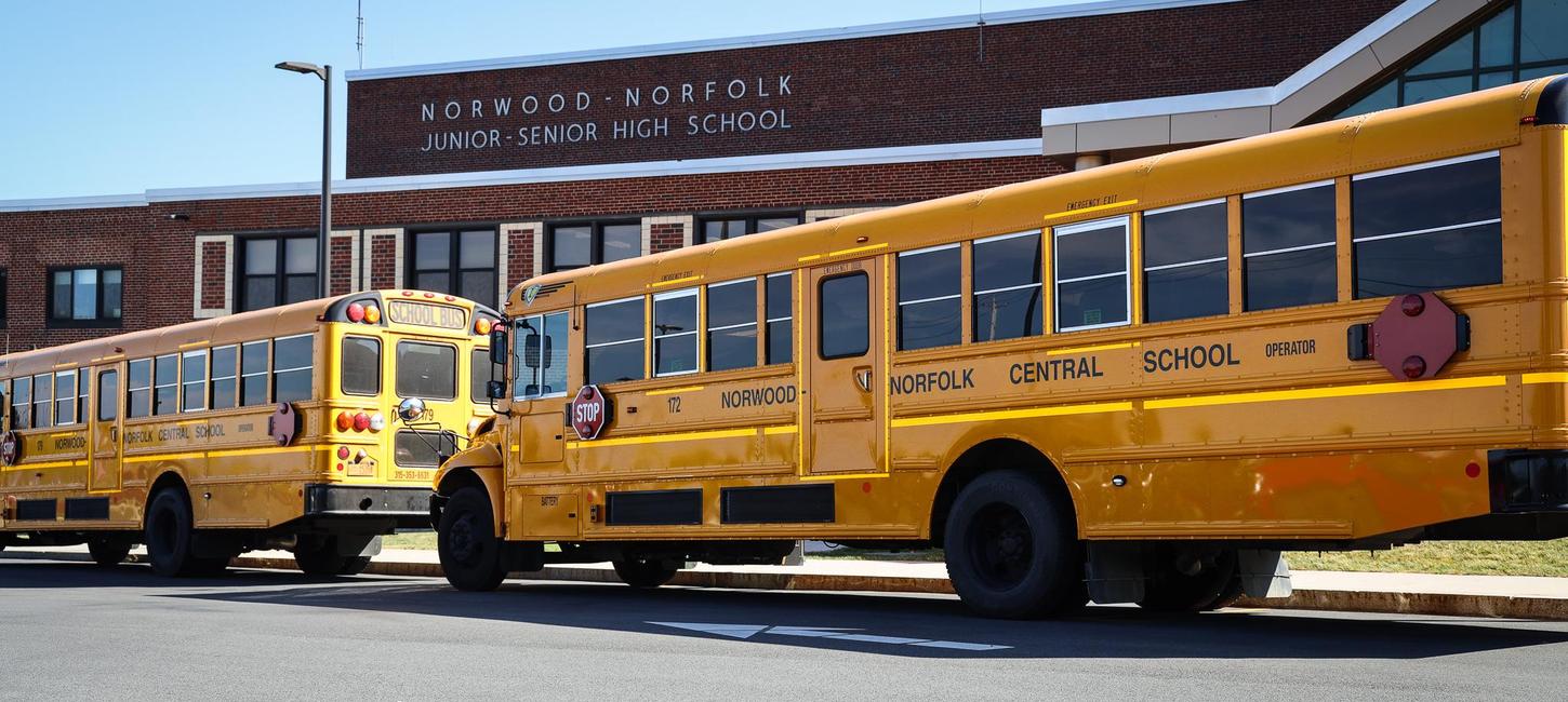 School Buses in front of school