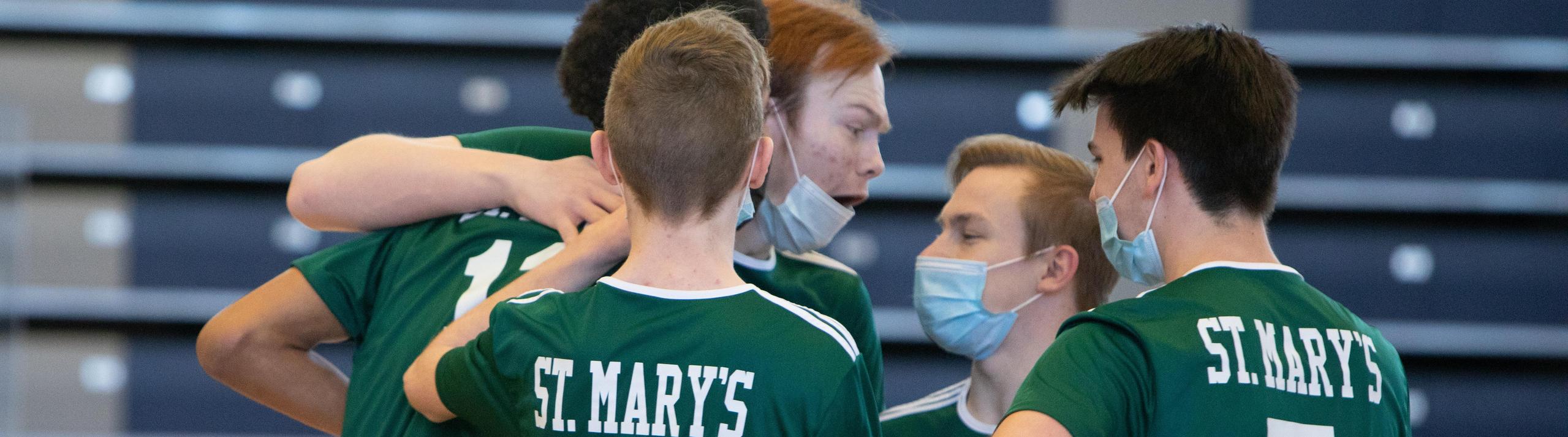 St. Mary's Volleyball Dragons celebrate their success together!