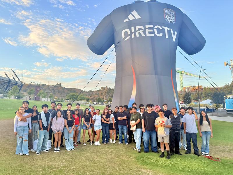 High school students pose for photo outside of Snapdragon Stadium.