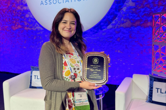 Taylor Revilla, posting with State Award at Texas Library Association Convention