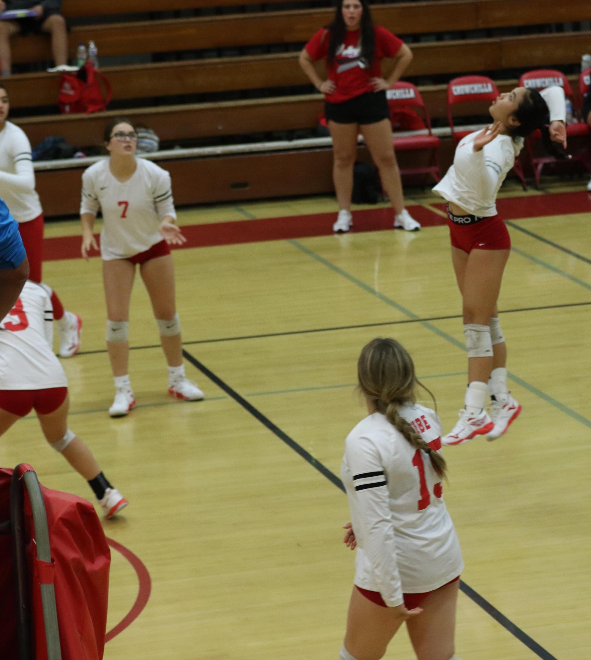 varsity volleyball players in action against golden valley