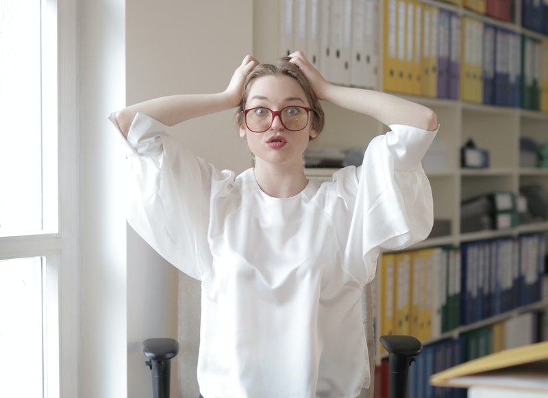 woman scratching head, confused