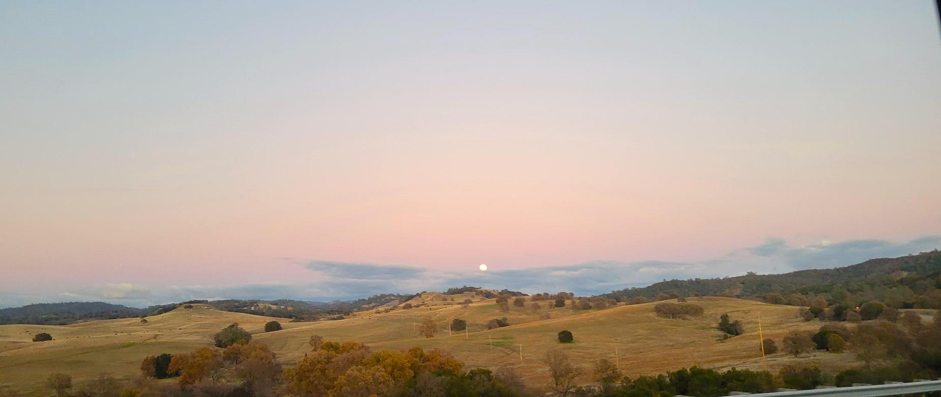 moon rise over dry hillside