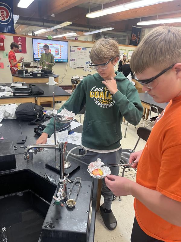 Demonstrating how rocks move through the rock cycle.