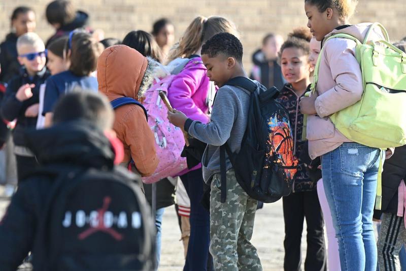 student with backpack on