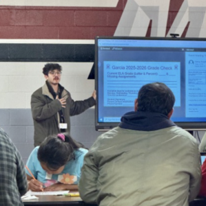 Parents at workshop looking at screen