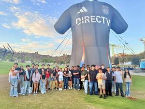 High school students pose for photo outside of Snapdragon Stadium.