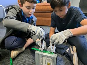 Fifth grade boys taking apart computers.