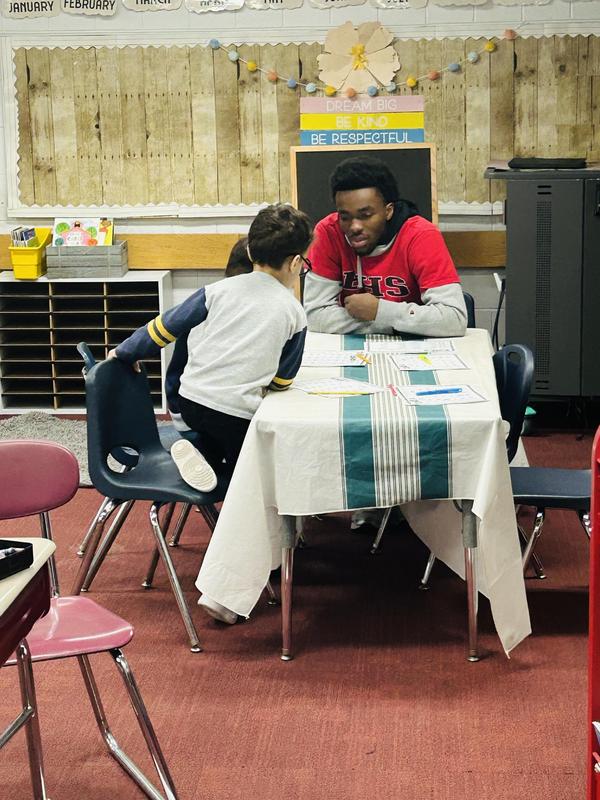 BHS Student sitting with Davis students