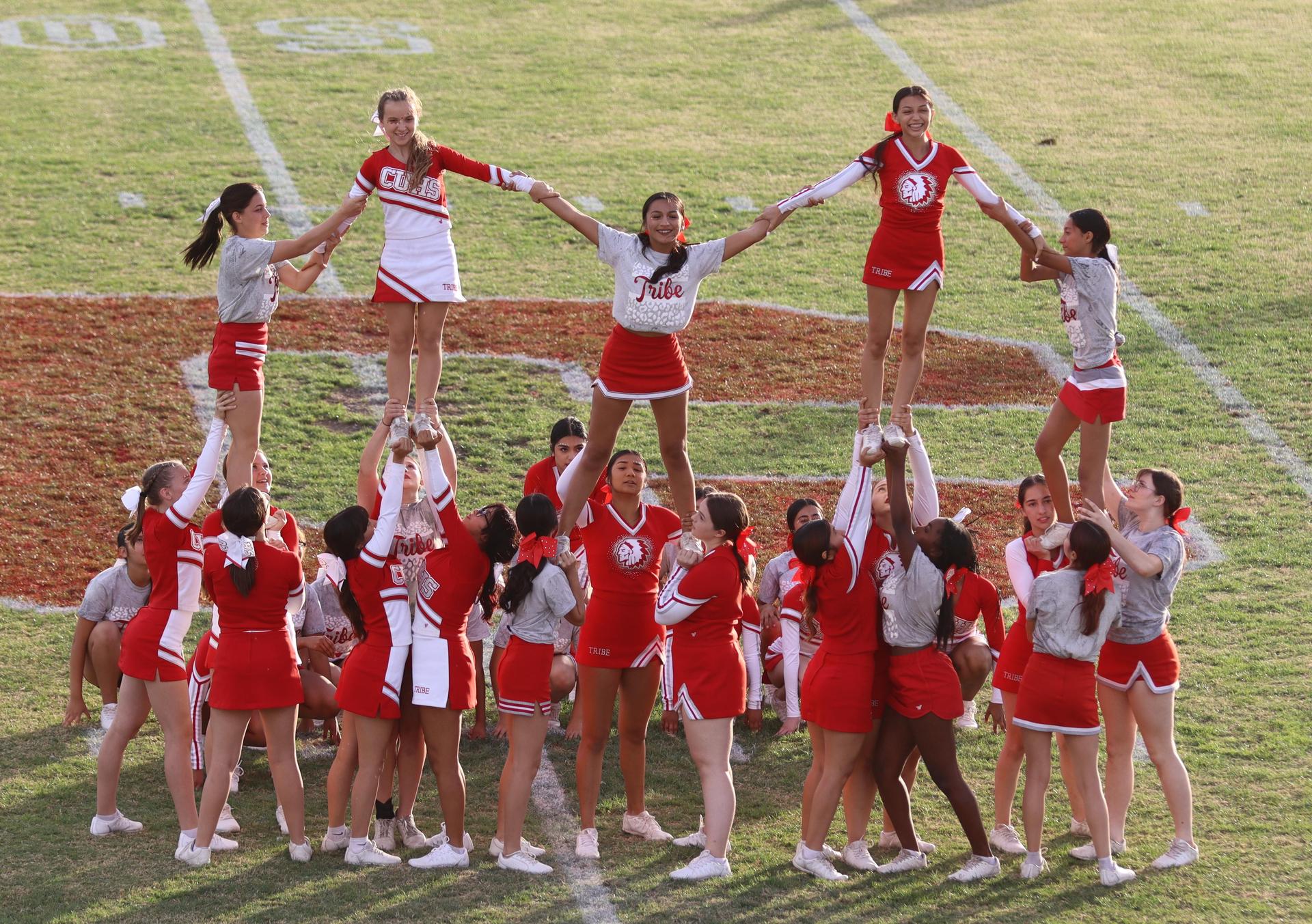 Combined cheer performing at halftime of the football game