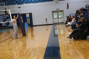 Guidance Counselor Justine Dasho speaks to incoming freshmen in the gym